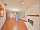Open dining area with hardwood floors and stone fireplace at 220 Coleman E Dr, Winter Haven, FL 33884