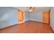 Bedroom with wood flooring and access to bathroom at 220 Coleman E Dr, Winter Haven, FL 33884