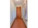 Front entry with wood flooring, built-in closet, and stained glass door at 220 Coleman E Dr, Winter Haven, FL 33884