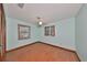 Bedroom with wood flooring and two windows at 220 Coleman E Dr, Winter Haven, FL 33884