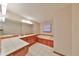 Primary bathroom with soaking tub, double vanity, and tile flooring at 220 Coleman E Dr, Winter Haven, FL 33884