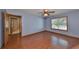 Bedroom with wood flooring and a window at 220 Coleman E Dr, Winter Haven, FL 33884