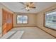 Spacious bedroom featuring wood closet doors and neutral decor at 220 Coleman E Dr, Winter Haven, FL 33884