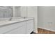 Modern bathroom with dual sinks and a walk-in shower at 4270 Sw 143Rd Lane Rd, Ocala, FL 34473