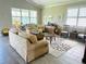 Spacious living room featuring a neutral color palette,tile floors and ample natural light at 7771 Lake James Blvd, Lakeland, FL 33810