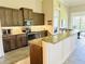 Modern kitchen with dark brown cabinets and granite countertops at 7771 Lake James Blvd, Lakeland, FL 33810