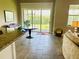 View of living room with sliding doors leading to the backyard at 7771 Lake James Blvd, Lakeland, FL 33810