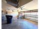 Attached garage with storage shelving and large door at 5446 Pebble Beach Dr, Lakeland, FL 33812