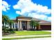 Two story house with columns and a three car garage at 5446 Pebble Beach Dr, Lakeland, FL 33812