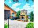 Outdoor patio with stone fireplace and lush landscaping at 5446 Pebble Beach Dr, Lakeland, FL 33812