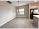 Simple dining room with tile floors and a window at 210 Kenny Blvd, Haines City, FL 33844