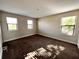 Well-lit bedroom featuring carpeted floors and large windows at 210 Kenny Blvd, Haines City, FL 33844