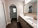 Modern bathroom with double vanity, large mirror, and walk-in shower at 210 Kenny Blvd, Haines City, FL 33844