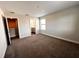 Bright bedroom with carpeted floor, private bathroom access, and walk-in closet at 210 Kenny Blvd, Haines City, FL 33844