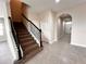 Staircase with brown carpet and dark brown railing at 210 Kenny Blvd, Haines City, FL 33844