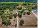 Aerial view showing home, driveway, and large lot at 22134 Obrien Rd, Howey In The Hills, FL 34737
