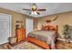 Charming bedroom with a queen-size bed and wood floors at 22134 Obrien Rd, Howey In The Hills, FL 34737