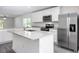 Modern kitchen with stainless steel appliances and an island at 16448 Sw 17Th Terrace Rd, Ocala, FL 34473