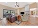 Living room with hardwood floors, fireplace and large TV at 3 Crescent Lake Way, Ormond Beach, FL 32174