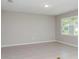 Spacious living room with large window and neutral wall color at 8322 Sw 52Nd Lane Rd, Ocala, FL 34481