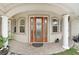 Elegant front door entrance with a welcoming and inviting feel at 13023 Sweet Hill Rd, Polk City, FL 33868