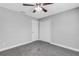 Spacious bedroom with grey walls, carpet and double door closet at 3419 Lisa Ln, Lakeland, FL 33801