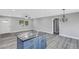 Spacious living area with an island, hardwood floors, and a chandelier at 3419 Lisa Ln, Lakeland, FL 33801