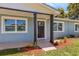 Front door view of newly renovated home with modern entryway at 3419 Lisa Ln, Lakeland, FL 33801