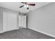 Spacious bedroom with grey carpet, neutral walls, and double-door closet at 3419 Lisa Ln, Lakeland, FL 33801