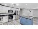Modern kitchen with stainless steel appliances and a blue island at 3419 Lisa Ln, Lakeland, FL 33801