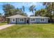 Newly renovated light blue home with a large yard at 3419 Lisa Ln, Lakeland, FL 33801