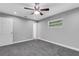 Bright bedroom featuring grey walls, ceiling fan and window blinds at 3419 Lisa Ln, Lakeland, FL 33801