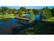 Picturesque bridge reflecting in water at 7811 Red Grange Blvd, Indian Lake Estates, FL 33855
