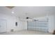 Spacious garage with an automatic garage door opener at 7811 Red Grange Blvd, Indian Lake Estates, FL 33855