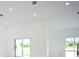 Bright and airy living room with sliding glass doors leading to the backyard at 7811 Red Grange Blvd, Indian Lake Estates, FL 33855