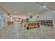 Game room with pool tables at 7811 Red Grange Blvd, Indian Lake Estates, FL 33855