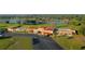 Aerial view of clubhouse and golf course at 7811 Red Grange Blvd, Indian Lake Estates, FL 33855