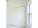 White double door closet in bedroom at 7811 Red Grange Blvd, Indian Lake Estates, FL 33855