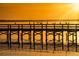 Birds on a pier at sunset over the water at 7811 Red Grange Blvd, Indian Lake Estates, FL 33855