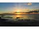 Beautiful sunset over the lake at 7811 Red Grange Blvd, Indian Lake Estates, FL 33855