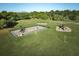 Community playground with playsets at 7811 Red Grange Blvd, Indian Lake Estates, FL 33855