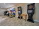Game room featuring arcade games and a dartboard at 7811 Red Grange Blvd, Indian Lake Estates, FL 33855