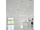 Open concept living area with kitchen and dining views at 7811 Red Grange Blvd, Indian Lake Estates, FL 33855