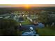 Aerial view of community with lakefront properties at 7811 Red Grange Blvd, Indian Lake Estates, FL 33855