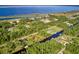 Aerial view of waterfront community with lush green landscape at 7811 Red Grange Blvd, Indian Lake Estates, FL 33855