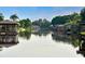 Tranquil canal view with waterfront homes at 7811 Red Grange Blvd, Indian Lake Estates, FL 33855