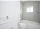 Bathroom with a bathtub, toilet, and single vanity at 7811 Red Grange Blvd, Indian Lake Estates, FL 33855
