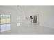 Bright and airy living room with tile floors at 7811 Red Grange Blvd, Indian Lake Estates, FL 33855