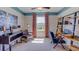 Home office with built-in shelving, desk, and comfortable seating at 140 Hickory Course Trl, Ocala, FL 34472