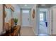 Bright entryway with mirror and view to bedroom at 140 Hickory Course Trl, Ocala, FL 34472